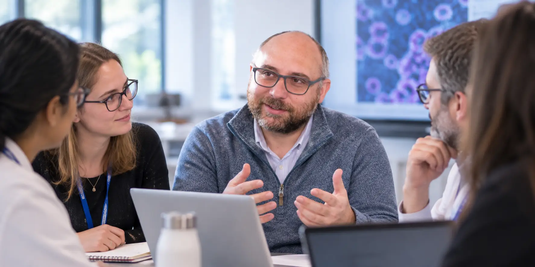 Research team discussing work together during a meeting